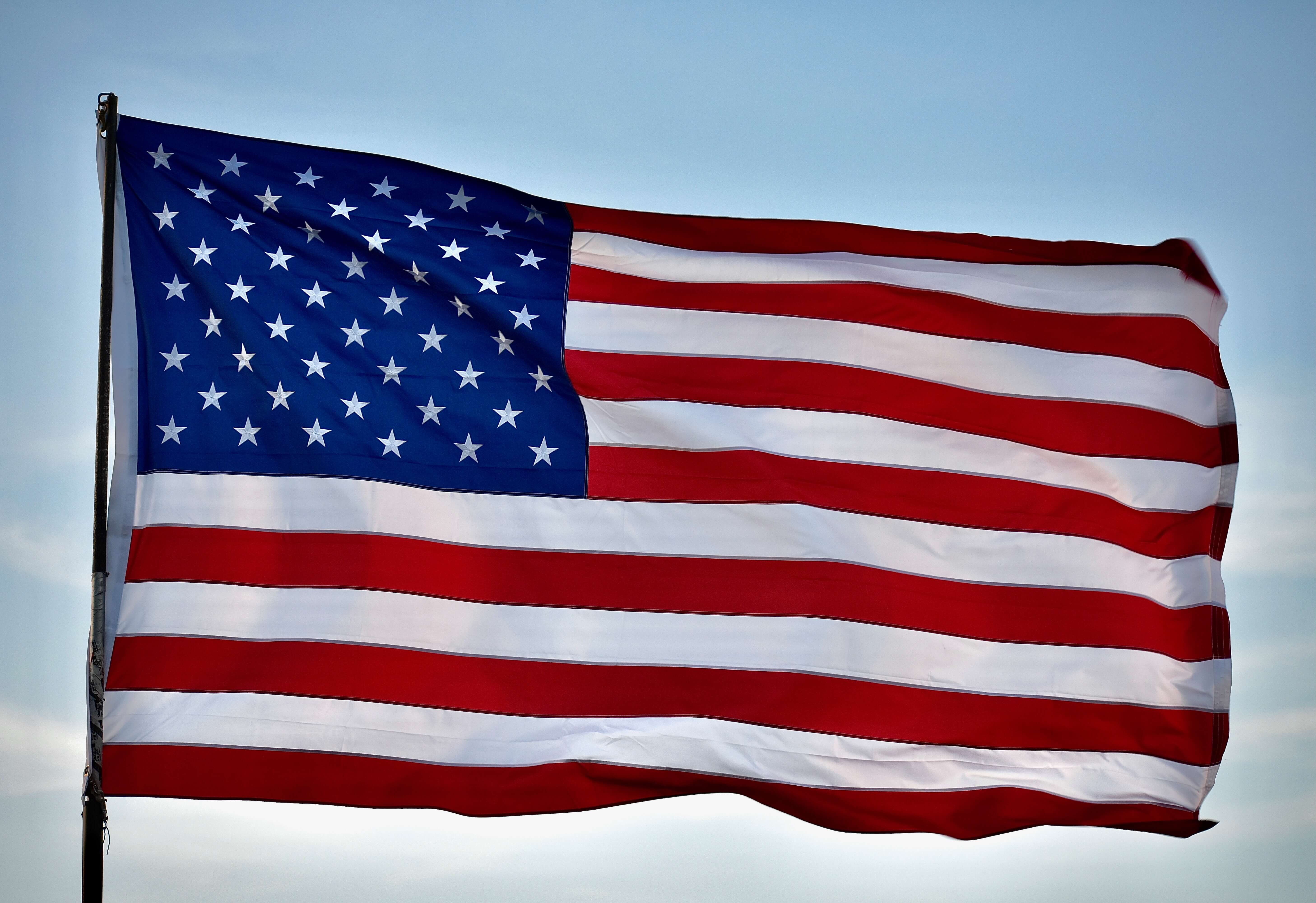 The American flag waving in the wind.
